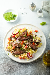 Beef steak salad with pasta and vegetables