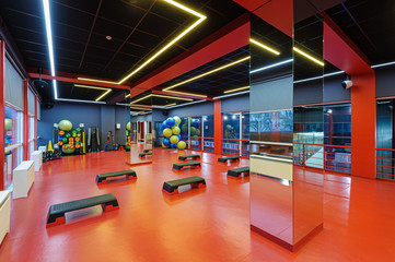 Aerobics gym room interior with step decks