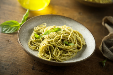 Spaghetti with pesto sauce and fresh basil