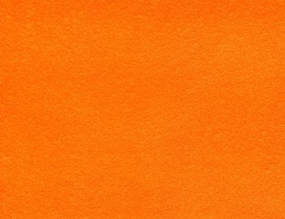 Orange textured background. Blank bright wallpaper. 