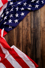American flag on old brown wooden table