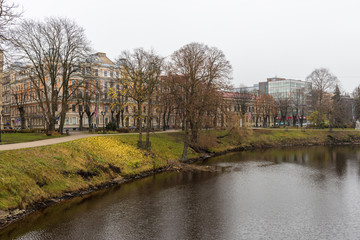 park in Riga with a canal and a bridge