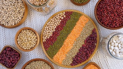 Wooden Bowls With Legumes: Mung Beans, White And Red Kidney Beans, Chickpes, Soybeans, Orange And Green Lentils.