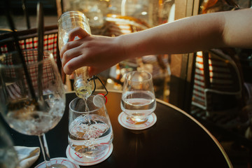Pouring water at a cafe in Paris