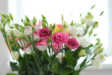 Beautiful Eustoma and Roses flowers, white eustoma on white background.Wedding invitation in minimalist style with eustoma. Template for greeting wedding or spring card. Copy space. Mother's day card