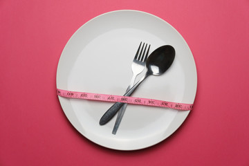 empty plate with fork and spoon