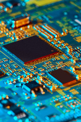 Electronic circuit board with electronic components such as chips close up. The concept of the electronic computer hardware technology.