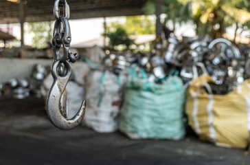 used forklift hook in the recycling industry plant with selective focus.