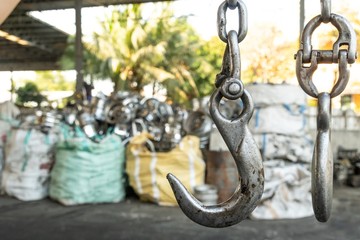 used forklift hook in the recycling industry plant with selective focus.