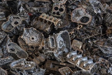 Stack of aluminium alloy cylinder head for recycling. . Scrap engines parts for recycling.