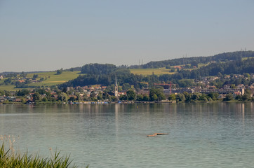 view of Pfeffikon city across the lake of Pfeffikon