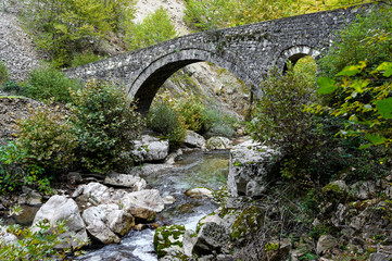 View of the traditional stone bridge of Filos at the area of Tzoumerka mountains in Epirus, Greece