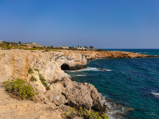 Fototapeta na wymiar View to sea cave and stone cliffs near 