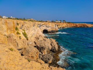 Fototapeta na wymiar View to sea cave and stone cliffs near 
