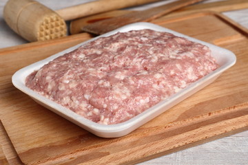Ground chicken in polystyrene food tray