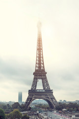 Fototapeta premium Postcard with a view of the Eiffel Tower in the fog