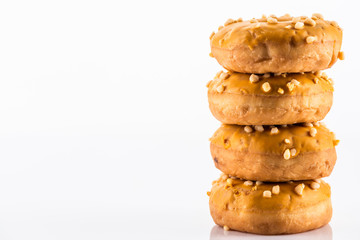 Salted Caramel Donut or Doughnuts on White Reflective Background with Copy Space
