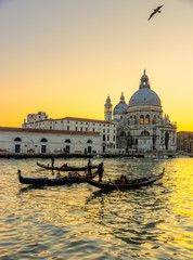 Fototapeta na wymiar Sunset on Grand Canal and Basilica of Santa Maria della Salute, Venice, Italy 