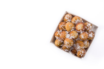Carnival fritters or buñuelos de viento in bowl for holy week isolated on whiop view. Copy spacete background. T