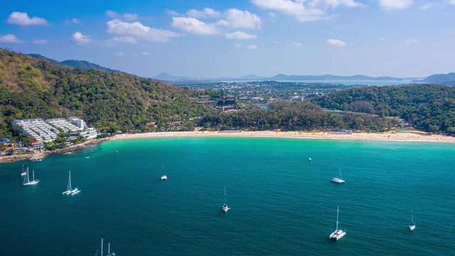 Hyperlapse of Nai Harn beach during sunny day, Phuket island, Thailand. Timelapse with zoom in effect