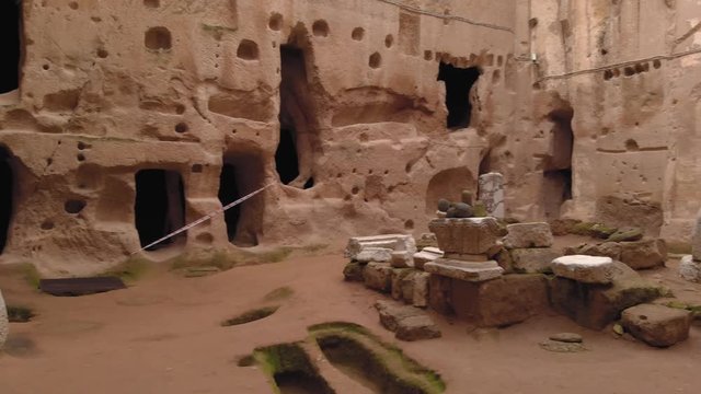 Aerial view of Gumusler cave monastery. Ancient cave monastery surrounded by stone walls in Cappadocia, Turkey