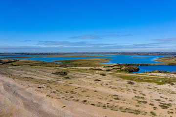 Pagham Harbour nature reserve from the beach aerial photo on a beautiful sunny winters day. 