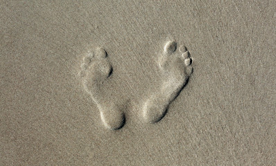Human footprint in the sand. Nature background.