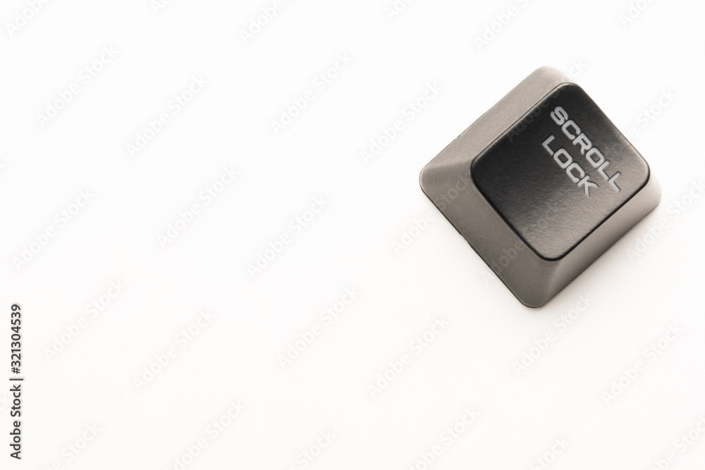 Fototapete black keyboard button with a white inscription scroll lock in the corner on a white background