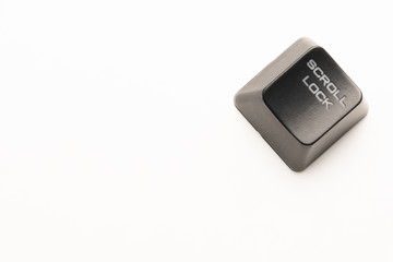 black keyboard button with a white inscription Scroll Lock in the corner on a white background
