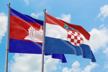 Croatia and Cambodia flags waving in the wind against white cloudy blue sky together. Diplomacy concept, international relations.