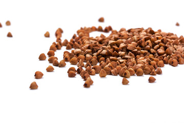 Close up of buckwheat grains isolated on white background