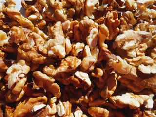 Walnuts brown horizontal background, vegetarian food