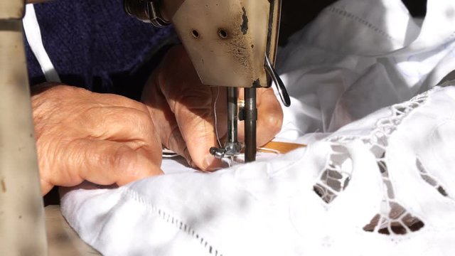 An Old Woman is Working with a Sewing Machine, 4k
