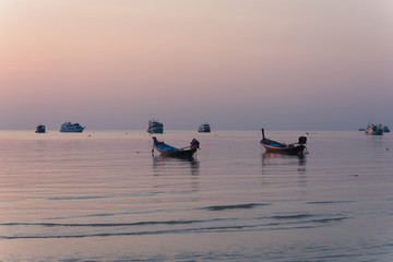 Naklejka premium Traditional Longtail Boat at Sunset in Koh Tao Thailand