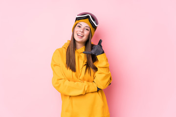 Young caucasian skier woman isolated showing a mobile phone call gesture with fingers.