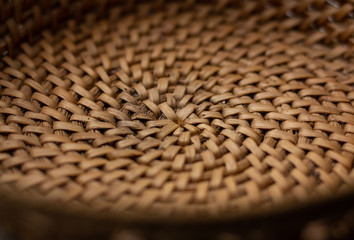 Fototapeta na wymiar The bottom of a small wicker basket close-up