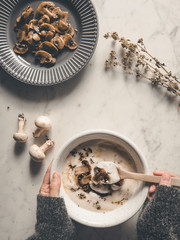eating creamy and rustic white soup with mushroom. Eating healthy vegetarian dinner. Cozy and warm food. Autumn warm puree. 3