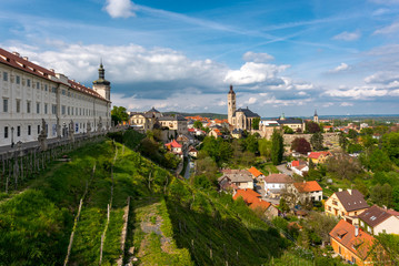 Fototapeta premium Panoramic view of Kutna Hora medival city in Czech Republic (Bohemia, Czechia) with a view on Barborska Street and Jesuit Collage on the left and its winery