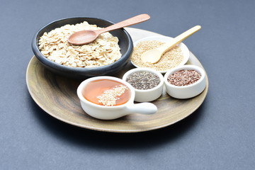 Natural oatmeal on light wooden background