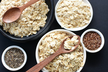 Natural oatmeal on light wooden background