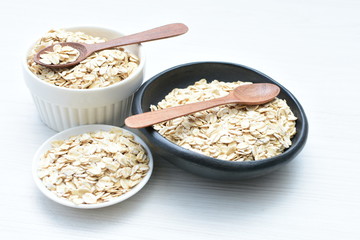 Natural oatmeal on light wooden background