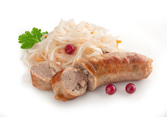 Fried sausage with sauerkraut, cranberry and fresh parsley