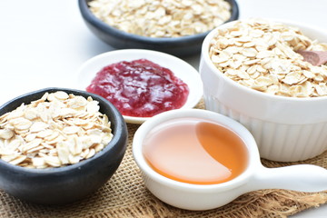 Natural oatmeal on light wooden background