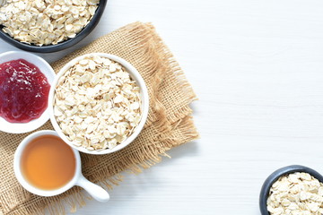 Natural oatmeal on light wooden background
