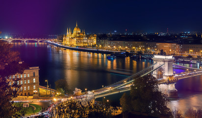 Fototapeta na wymiar Colorful evening cityscape. Fantastic Night panoramic view at Budapest. Hungarian landmarks, Parliament and Chain Bridge, Popular Travel destinations. popular plases for photographers