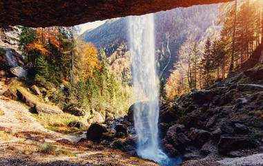 Fantastic sunny landscape. Pericnik waterfall in Slovenian Julian Alps in autumn under sunlight. Picture of vild area. Amazing nature Scenery. popular travel destination. Triglav National Park