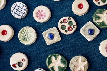 handmade ceramic jewelry on a blue denim surface