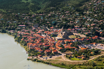 Panoramic view of Mtskheta (Mccheta) former capital city and one of oldest cities in Georgia on the bank of Kura river with Svetitskhoveli Cathedral Temple (Sweti Cchoweli) taken from Jvari Monastery