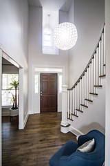 Interior Front Entrance Lobby of home with Vaulted cathedral ceilings and a window with a dark...