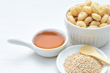 Quinoa cereal, accompanied by seeds and honey